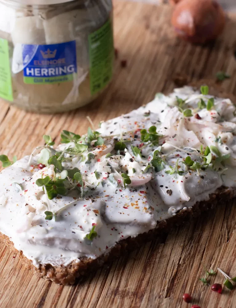 Elsinore - Dill herrings, Creme Fraiche, onions and pink peppercorns