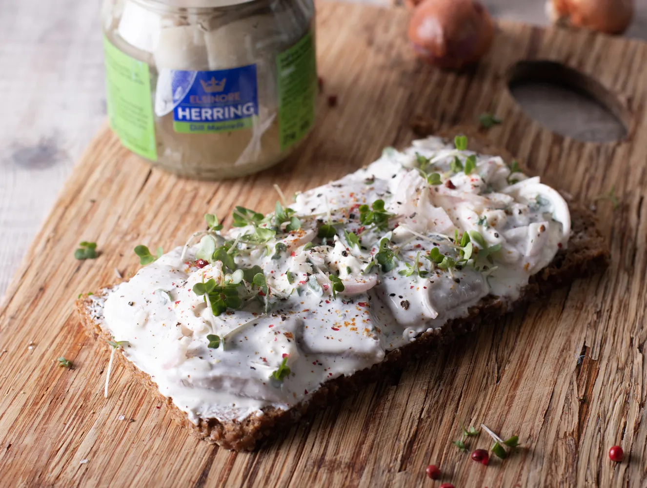 Elsinore - Dill herrings, Creme Fraiche, onions and pink peppercorns